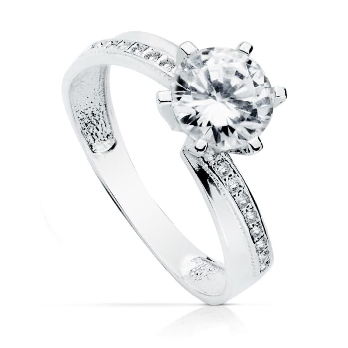 18K SOLITARIO ORO BLANCO CON CIRCONITAS Y 6 GARRAS CON CIRCONITA DE 7MM