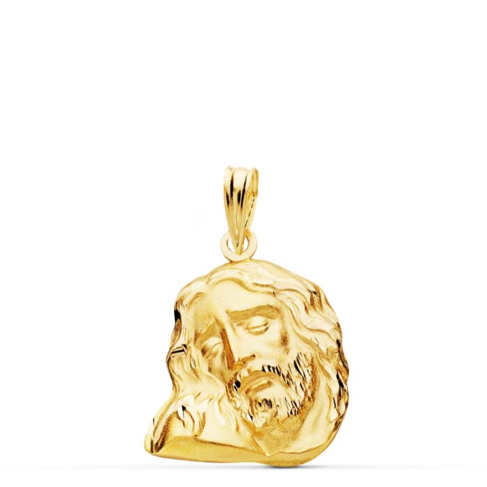 Colgante de oro amarillo de 18 quilates con el rostro de Cristo en relieve, tamaño pequeño-mediano 20x16 mm, sobre fondo blanco.