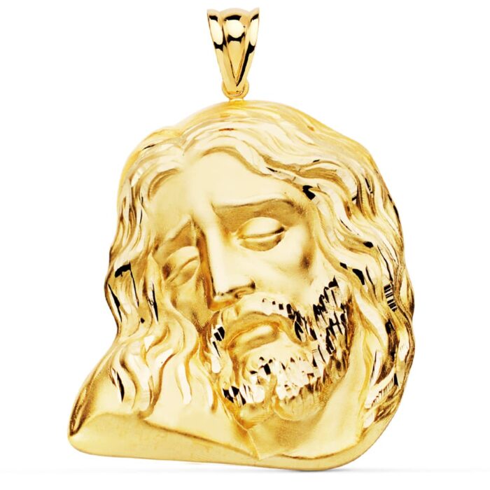 Colgante de gran tamaño en oro amarillo de 18 quilates con el rostro de Cristo en relieve detallado, dimensiones 42x35 mm.