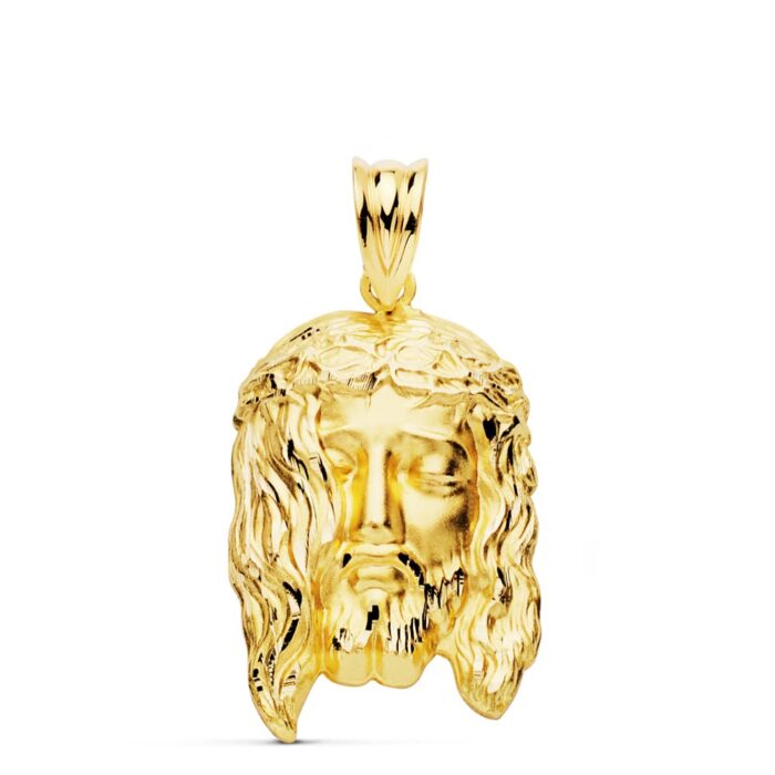 Colgante de la Cabeza de Cristo con potencias en oro amarillo de 18 quilates, tamaño medio 26x16 mm, sobre fondo neutro.