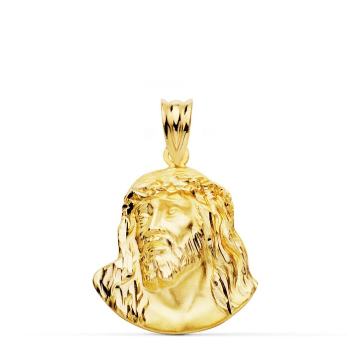 Colgante de oro amarillo de 18 quilates con el rostro de Cristo estilo Murillo en relieve, tamaño 23x18 mm sobre fondo blanco.