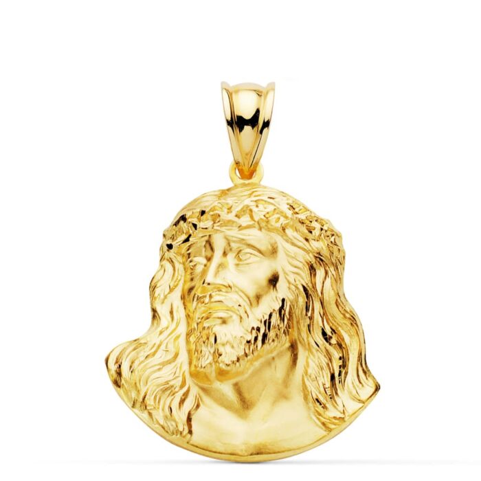 Colgante de oro amarillo de 18 quilates con el rostro de Cristo (Santo Rostro) en relieve detallado, tamaño 27x22 mm.