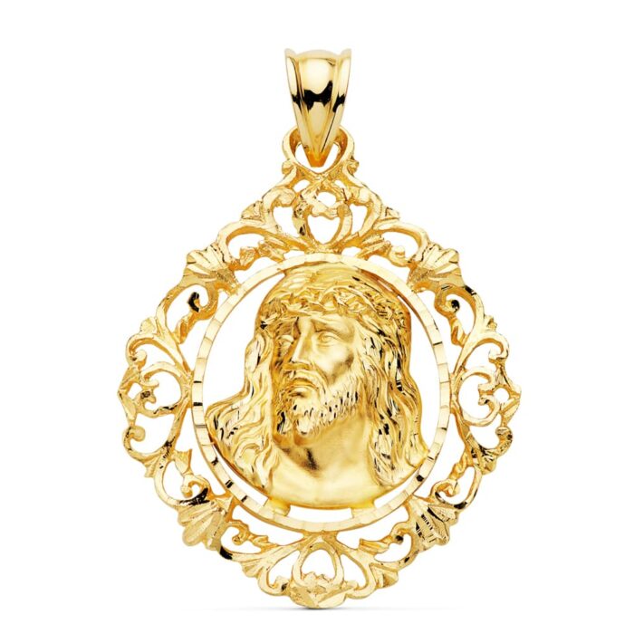 Colgante de la Cabeza de Cristo con potencias y cerco exterior en oro amarillo de 18 quilates, técnica de estampado, tamaño 32x29 mm.