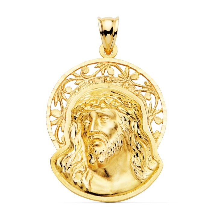 Colgante de oro amarillo de 18 quilates con el rostro de Cristo, potencias y una orla decorativa alrededor, tamaño 32x26 mm.