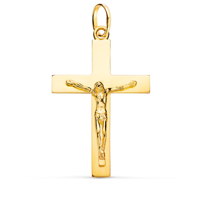 Cruz con la figura de Cristo crucificado en oro amarillo de 18 quilates, maciza, con palos rectangulares pulidos y acabado brillante, tamaño 38 x 24 mm.
